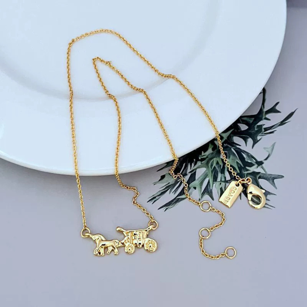 Coach Gold Mini Carriage Pendant Necklace